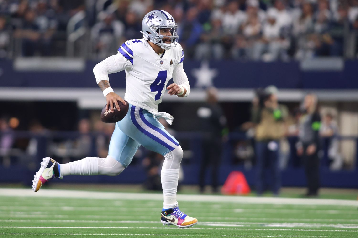 Dallas Cowboys quarterback Dak Prescott runs with the ball against the Seattle Seahawks.
